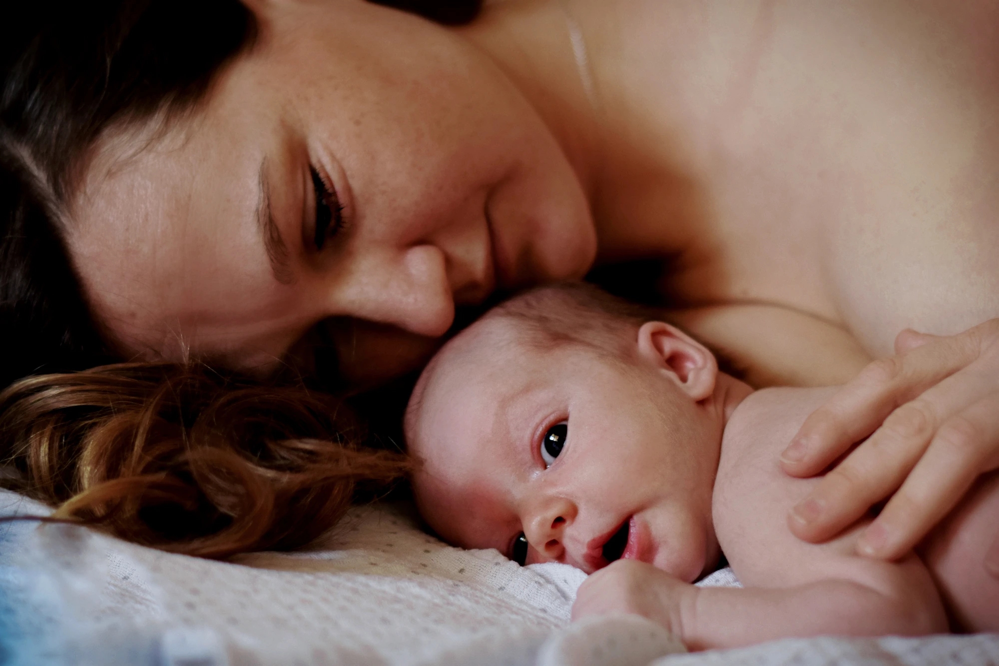 Mother and newborn bonding skin to skin after birth